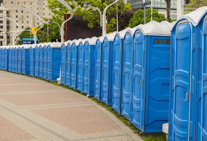 a row of portable restrooms at a fairground, offering visitors a clean and hassle-free experience in Bell